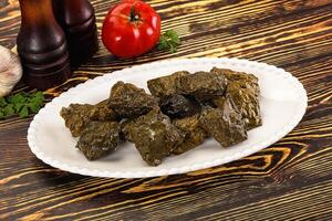 Stuffed dolma - meat in grape leaves photo