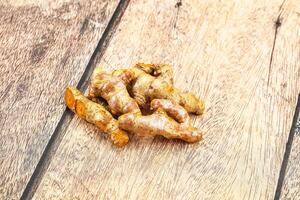 Fresh young Tumeric root heap photo