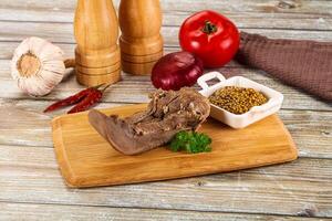 Steamed pork tongue with mustard photo