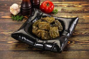 Stuffed dolma - meat in grape leaves photo
