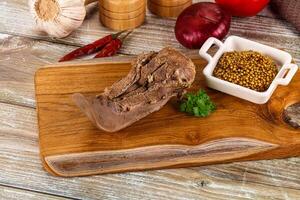 Steamed pork tongue with mustard photo