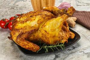 Homemade Grilled whole chicken with spices photo