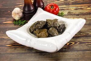 Stuffed dolma - meat in grape leaves photo