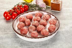 Uncooked raw beef meatball minced photo