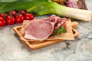 Raw pork steak loin with bone photo