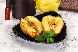 Baked quince with honey and cedar photo