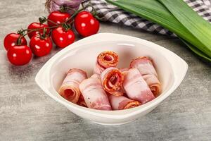 Fresh raw pork bacon roll photo