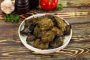 Stuffed dolma - meat in grape leaves photo
