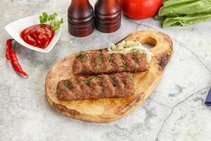 Kebab with beef served onion photo