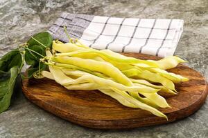 Raw green bean strings heap photo