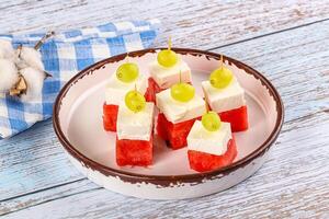 Watermelon with feta and grape photo