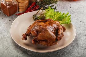 Baked small chicken with spices photo