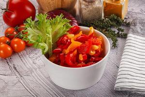 Diced raw bell red and yellow pepper photo
