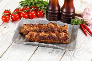 Chicken kebab minced meat and spices photo