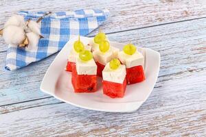 Watermelon with feta and grape photo
