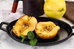 Baked quince with honey and cedar photo