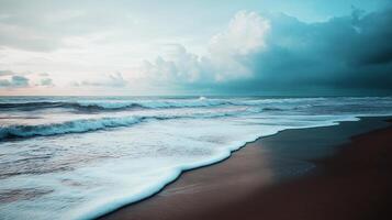 A cloudy sky over a beach with a large wave photo
