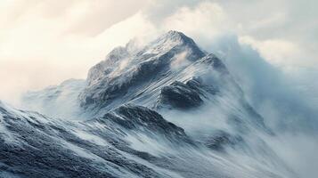 A mountain covered in snow with a foggy sky in the background photo