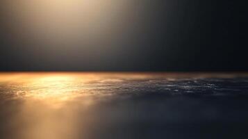 A blurry image of a body of water with a sun reflecting on the surface photo