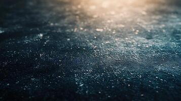 A blurry image of a wet surface with a blue background photo