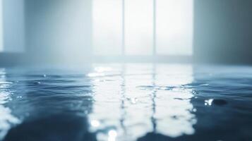 A blurry image of a room with a window and a puddle of water on the floor photo