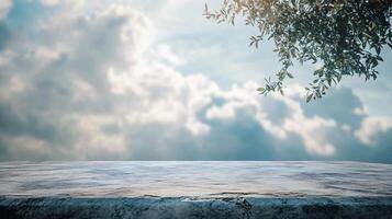 A cloudy sky with a tree in the background photo