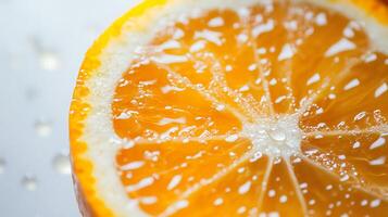 A close up of an orange with water droplets on it photo