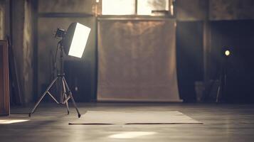 A dark room with a light on a tripod photo