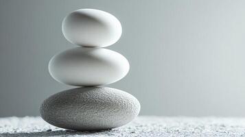 Three white stones stacked on top of each other photo