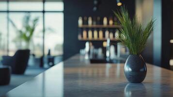 A vase with a plant in it sits on a counter in a room with a window photo