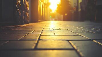 A brick sidewalk with a sun shining on it photo