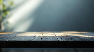 A wooden table with a view of a window photo
