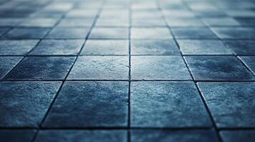 A blue tile floor with a pattern of squares photo