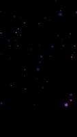 The magical particle sparkle explosion particles glow with Christmas theme color on black background. video