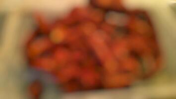 A blurry image of a bunch of red peppers photo