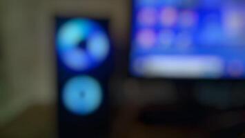 Blurred image of computer and speakers photo