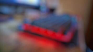 A blurry image of a red and black computer keyboard photo