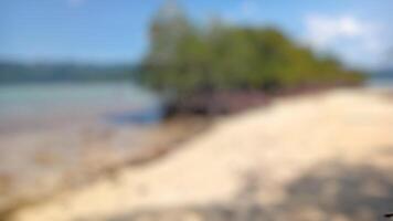Abstract blurred beach background. Perfect for travel, summer, vacation, and relaxation themes. photo