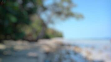 Abstract blurred beach background. Perfect for summer, vacation, travel, and relaxation themes. photo