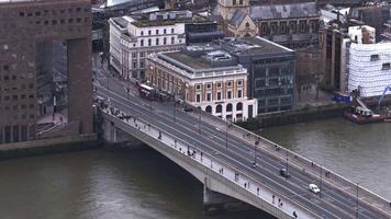 Aerial View of London Bridge with Red Double Decker Bus Crossing video