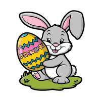 Easter bunny holding an easter egg vector