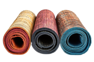 Colorful rolled mats in various textures and patterns displayed together on a plain background png