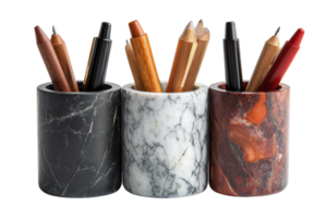 Stylish marble pen holders displaying various writing instruments in a modern workspace setting png