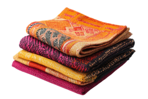 Vibrant collection of woven textiles displayed in a neat stack showcasing intricate patterns and colors png