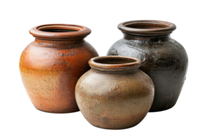 Traditional clay pottery displayed in a rustic setting showcasing craftsmanship and artistic design png