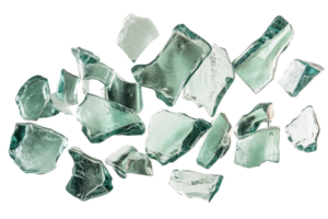 Fragments of clear glass scattered across a white surface showcasing various shapes and sizes with smooth edges and reflective surfaces png