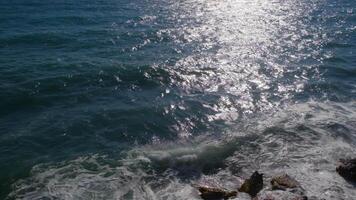 Top view of the ocean waves on a sunny day video