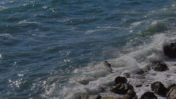 Top view of the ocean waves on a sunny day video