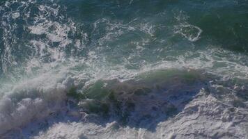 Top view of the ocean waves on a sunny day video
