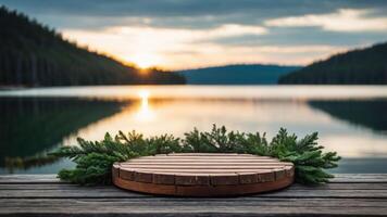 A serene lakeside view at sunset with a wooden platform adorned with greenery. photo
